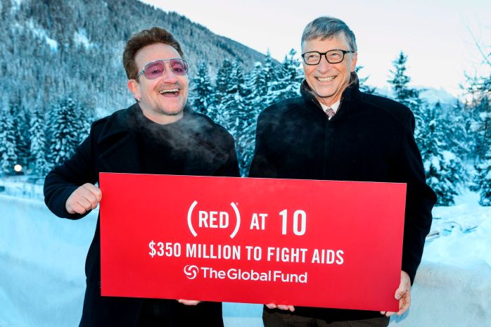 Singer of Irish band U2, Bono (L) poses with Bill Gates at the World Economic Forum annual meeting on January 22, 2016 in Davos to mark the 10 years of (RED). Launched at Davos in 2006, (RED) has raised $350 million for the Global Fund to fight AIDS, impacting 60 million lives. / AFP / FABRICE COFFRINI (Photo credit should read FABRICE COFFRINI/AFP/Getty Images)